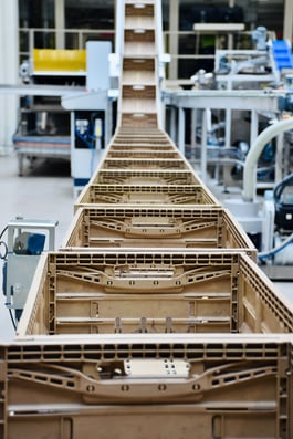 A row of empty bread baskets in the distributor warehouse