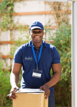 Buffalo Market delivery driver smiling as he delivers a shipment