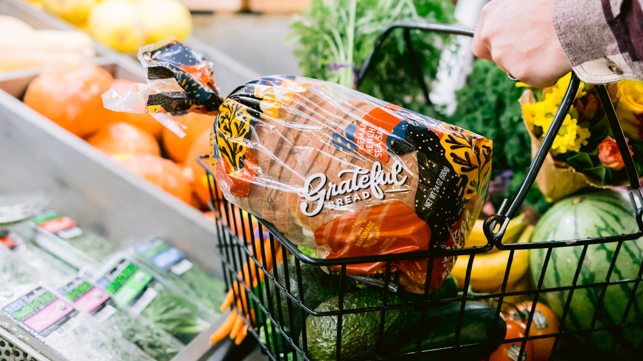 Grateful Bread package in a shopping cart with produce