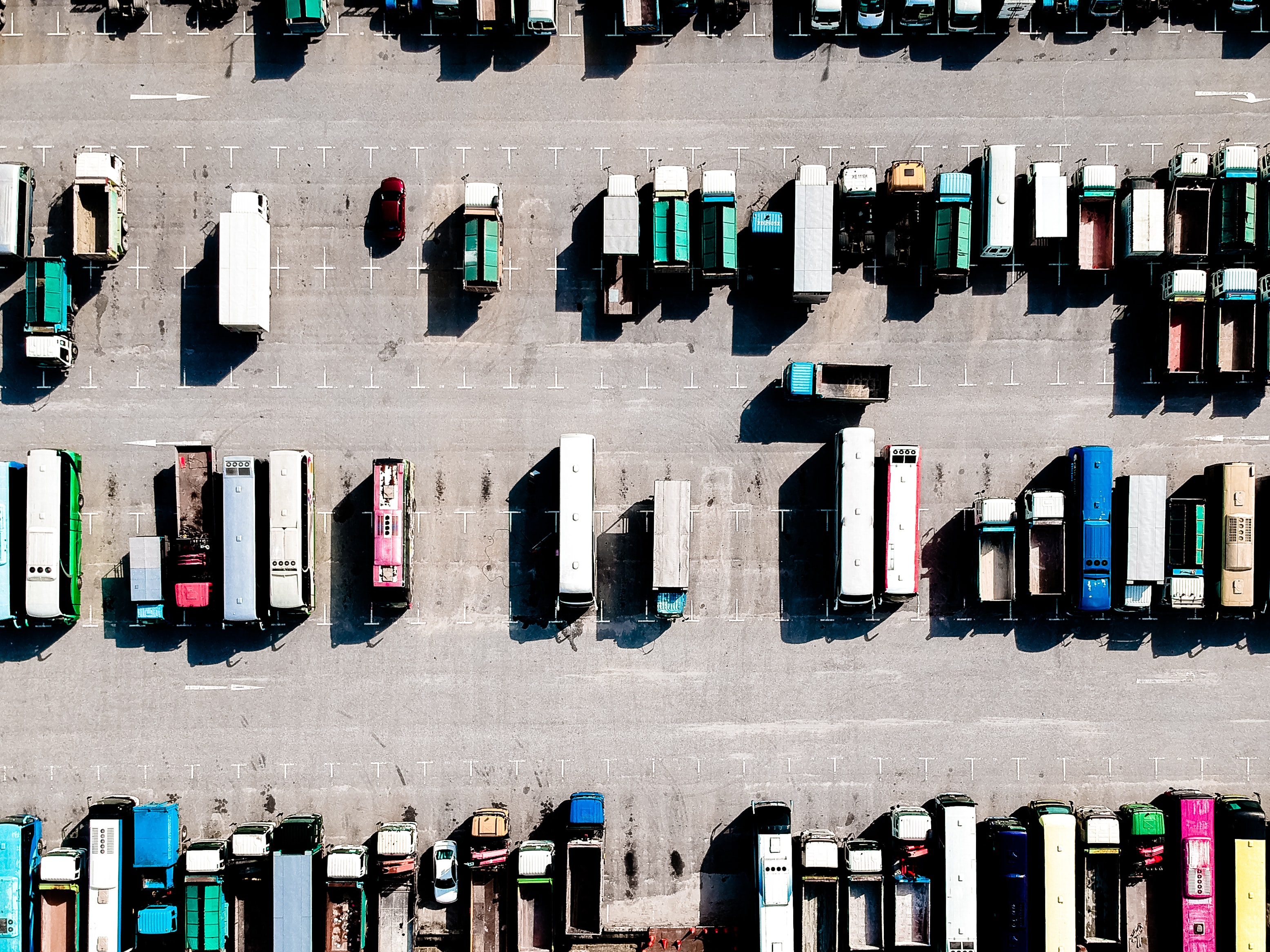 An aerial view of trucks parked in a parking lot