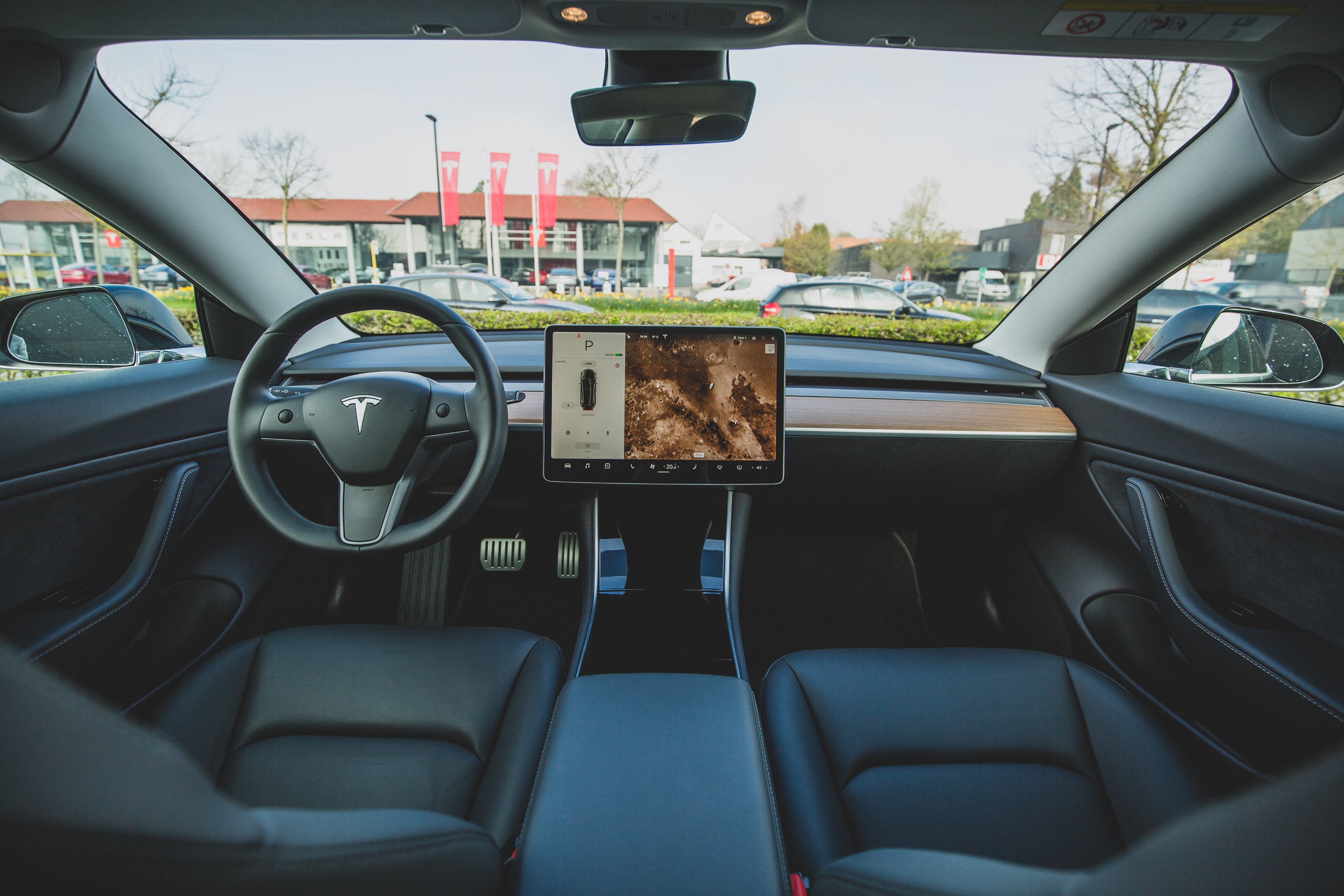 A view of the driver and passenger seat in a Tesla electric car