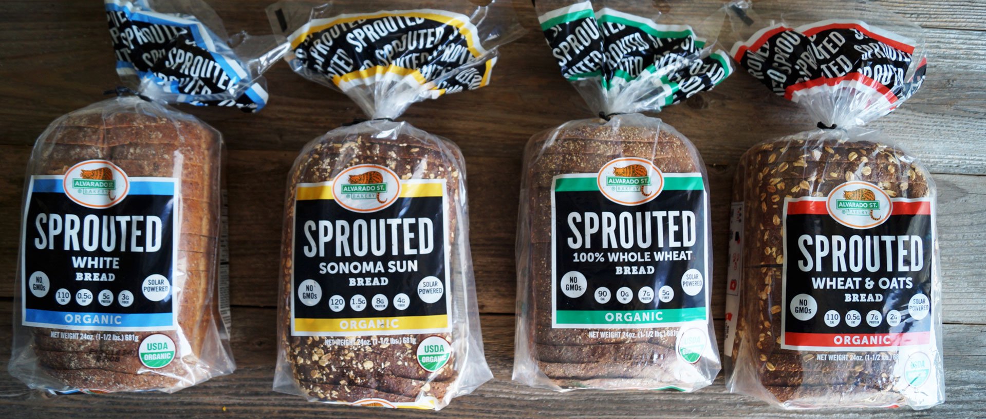 Sprouted white bread, sprouted Sonoma Sun bread, Sprouted Wheat and Oats bread loaves in a row