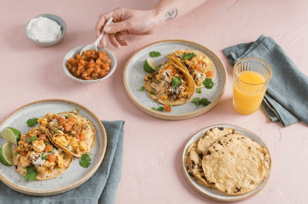 Staged product photo of Mi Rancho tortillas being used for tacos