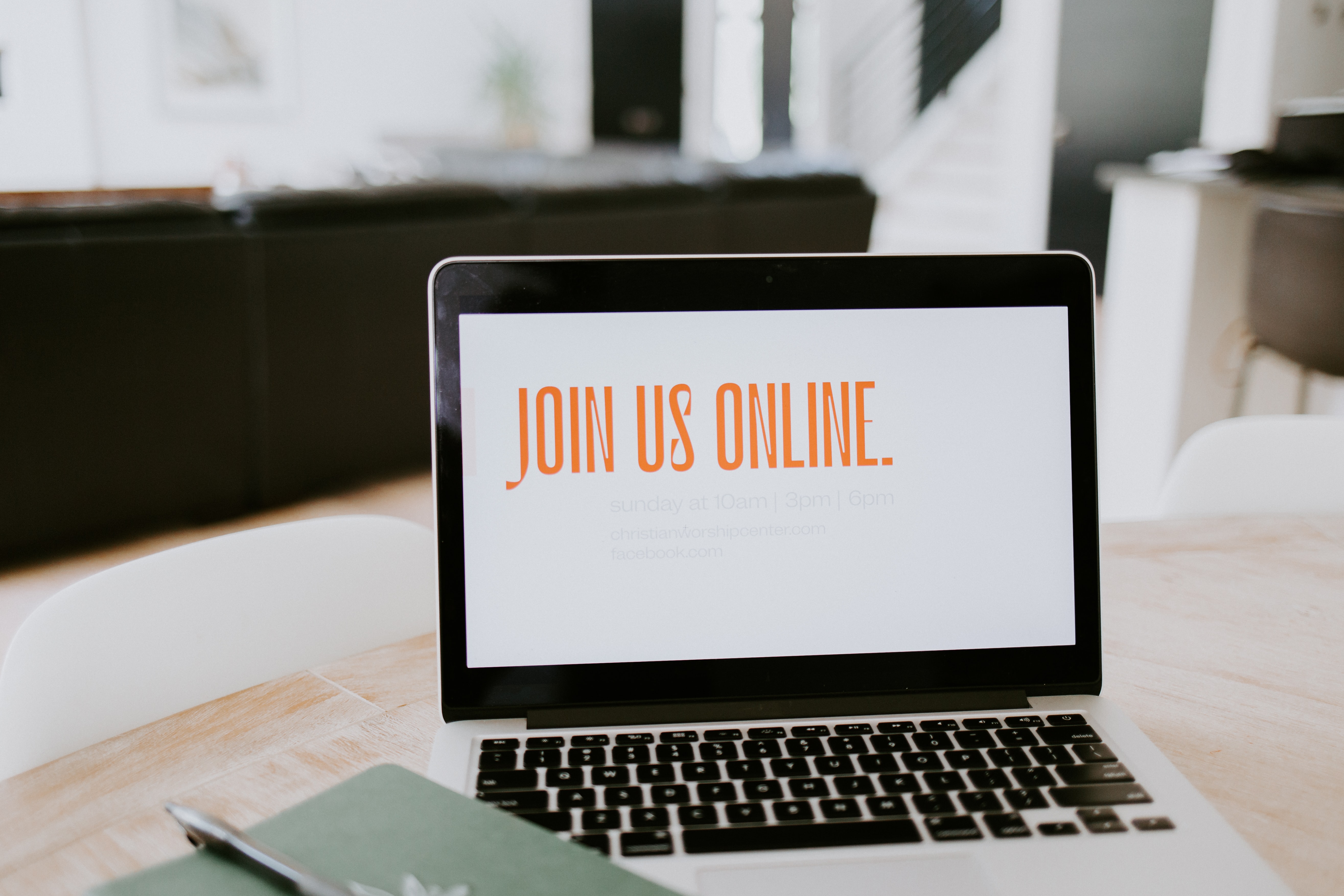 An open laptop with the words 'Join us online' showing on-screen