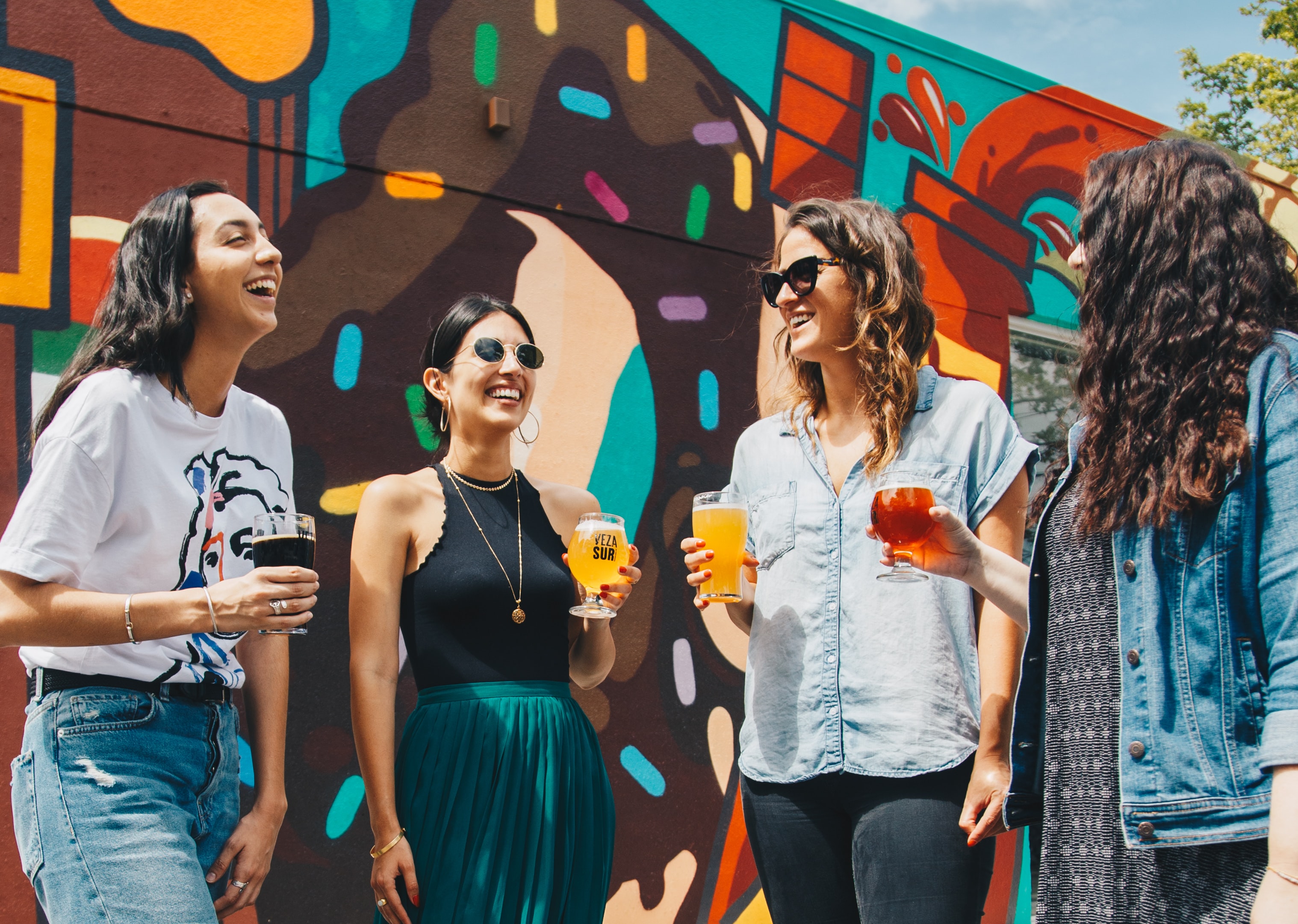 A group of young people with drinks.