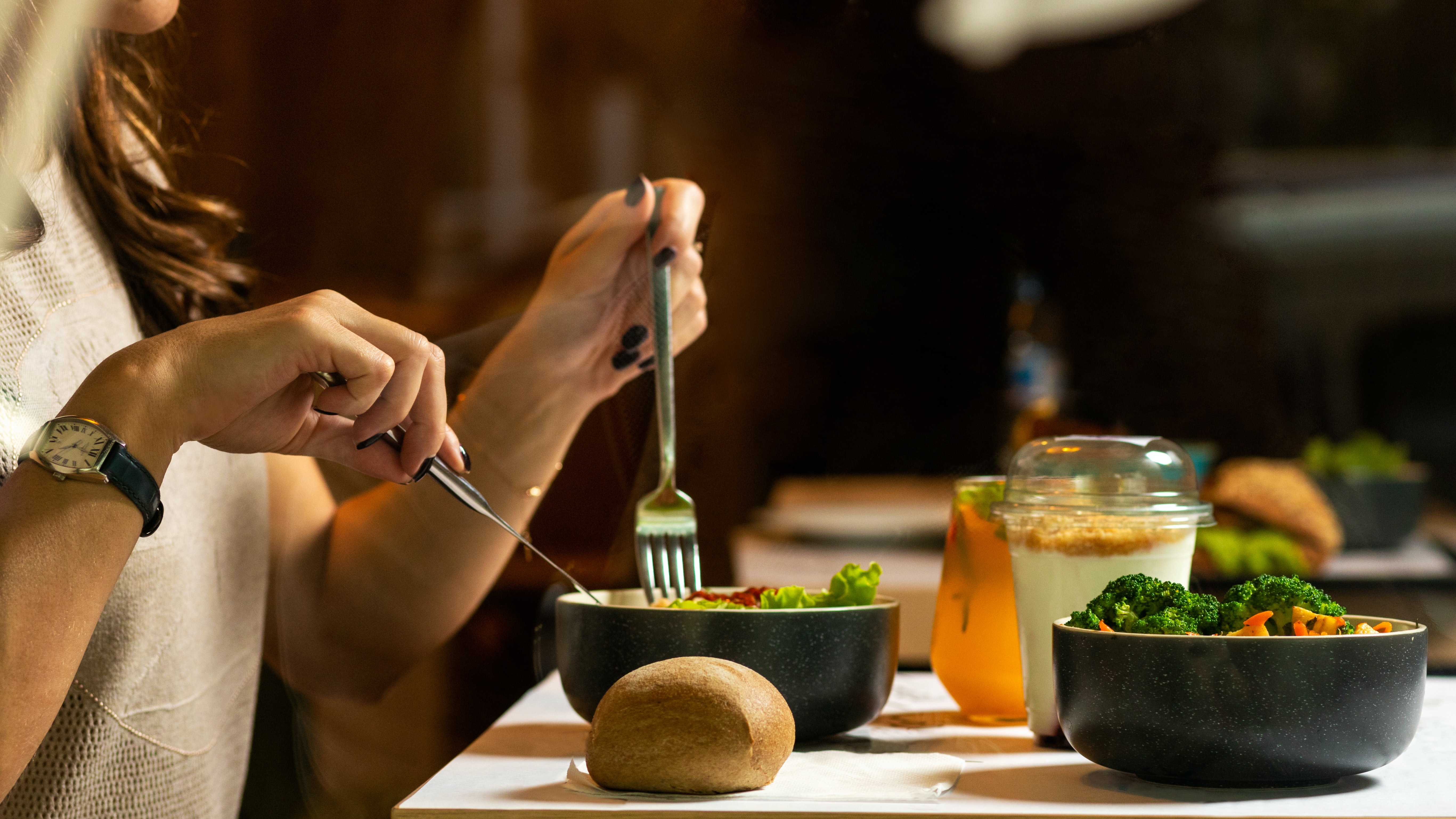A person eating a salad.
