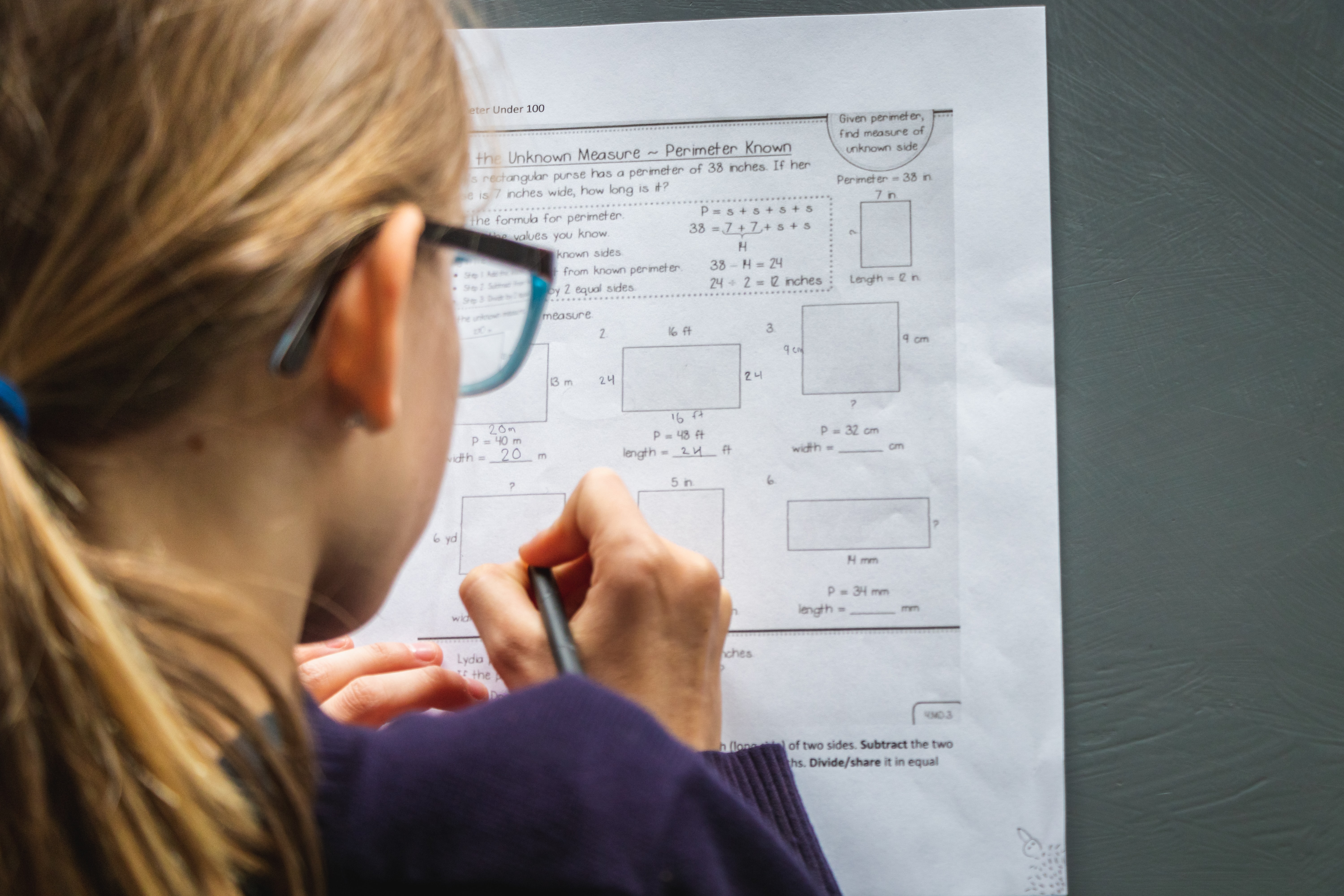 A person completing math problems.