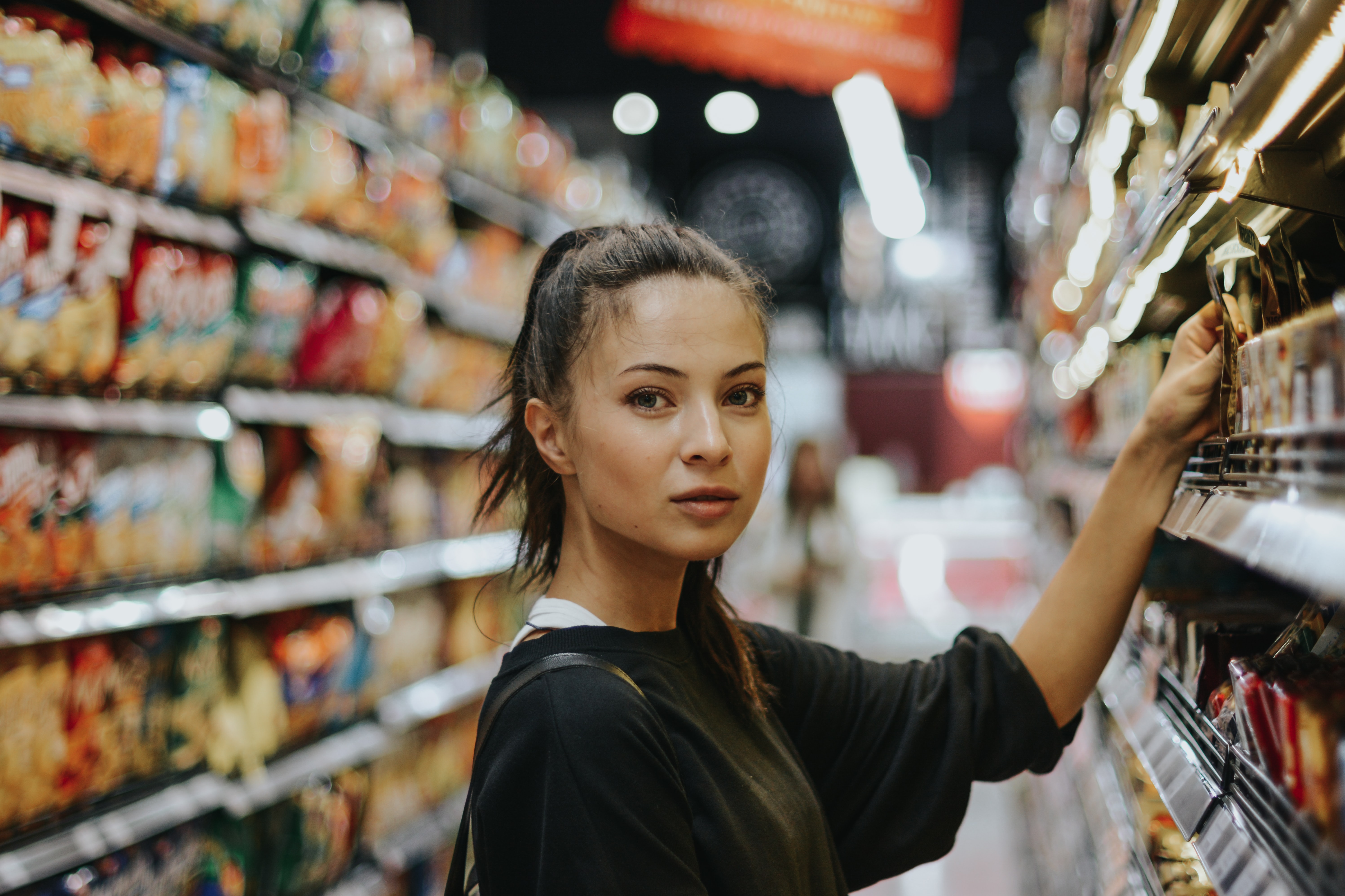 A woman buying groceries.