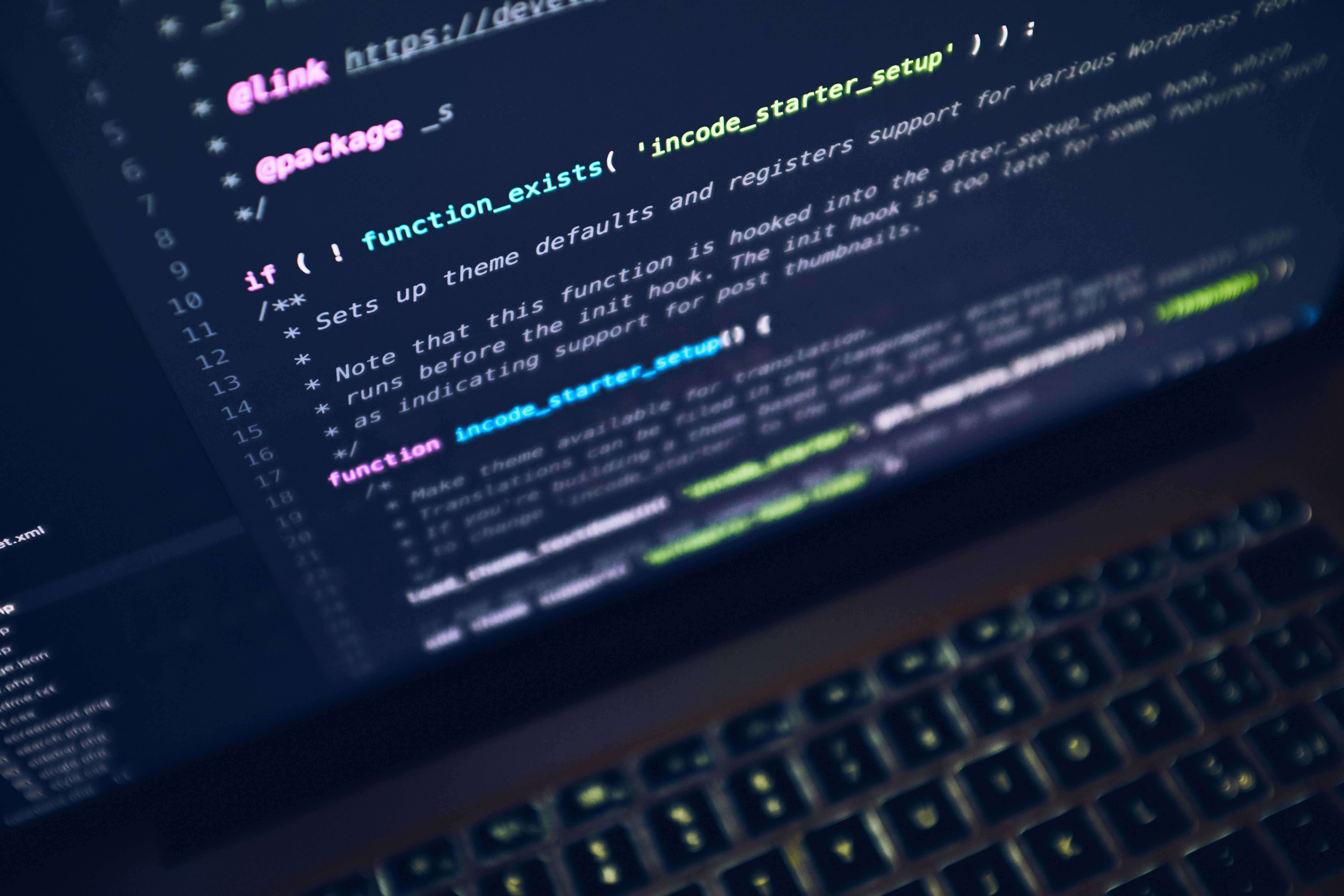 A laptop showing lines of code.