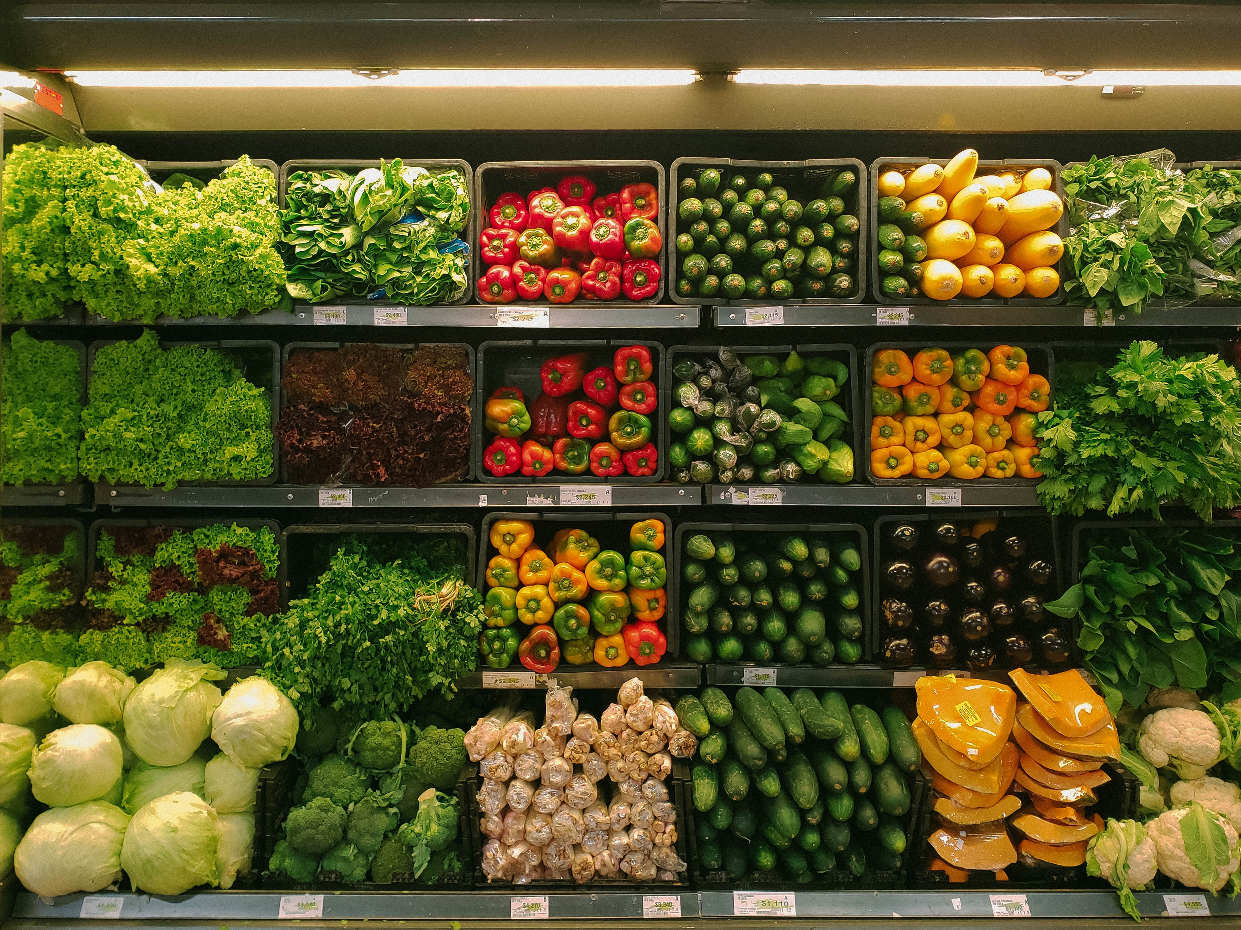 A supermarket display full of vegetables.