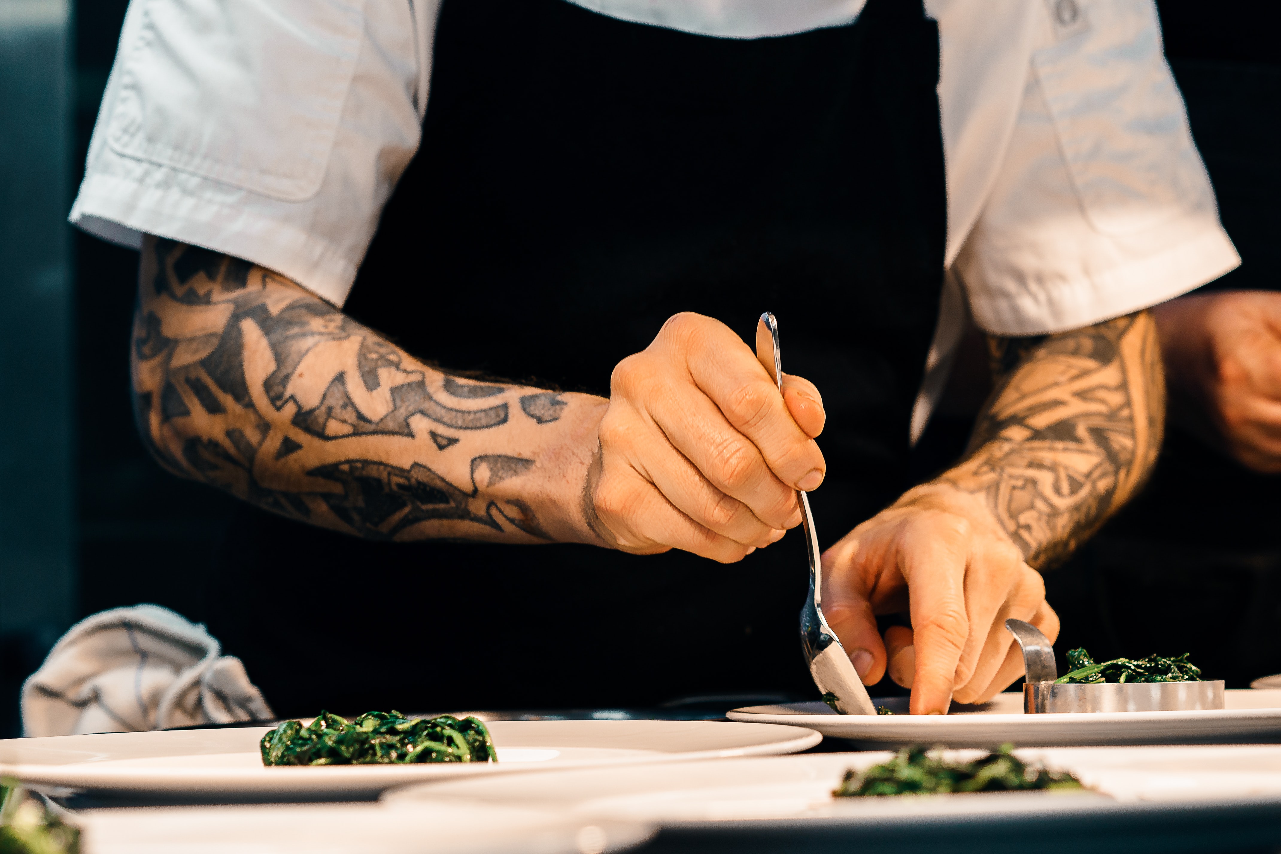 A chef plating up a meal.