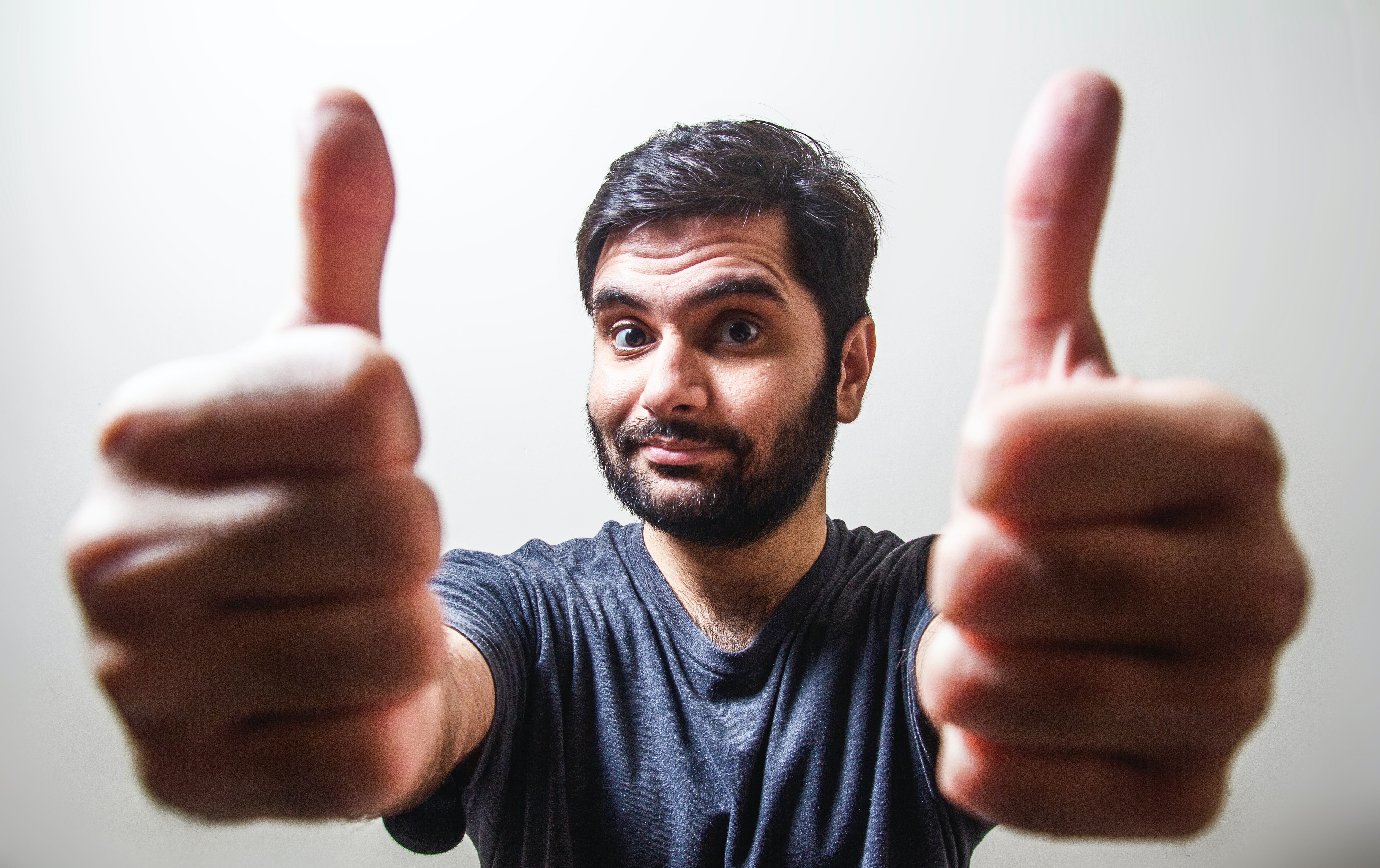 A man with two thumbs up.