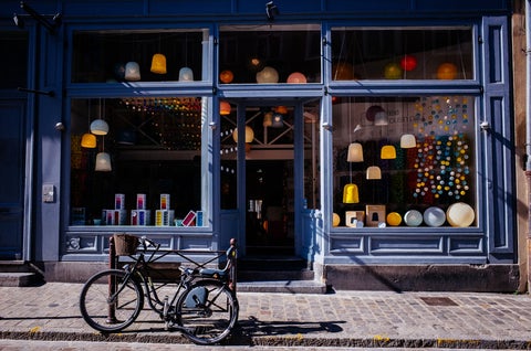 A push bike leans up against a well-designed store front window display