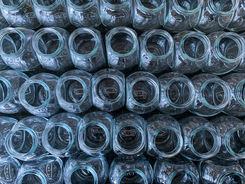 Rows upon rows of empty glass jars