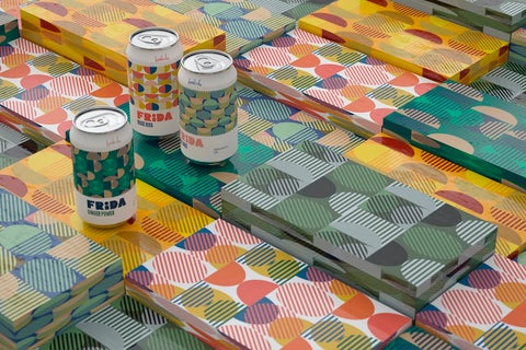 Colorful, patterned beverage cans with colorful, patterned wrapping paper