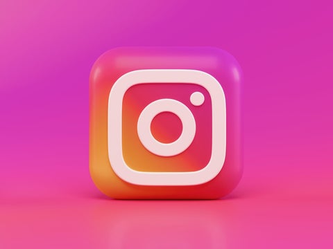 Instagram logo against a hot pink background