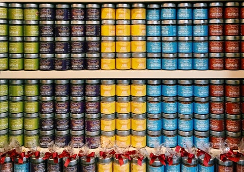 Shelves stacked with colored jars