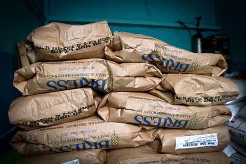 Bags of flour in a stack.