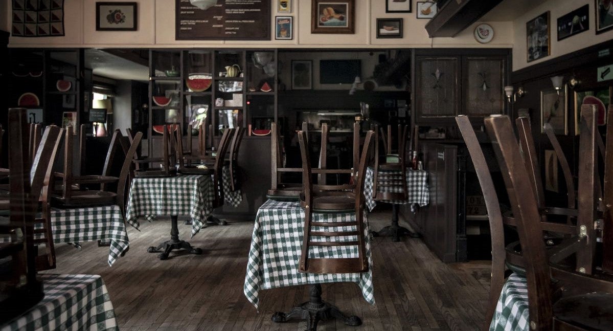 closed restaurant with chairs put up on tables