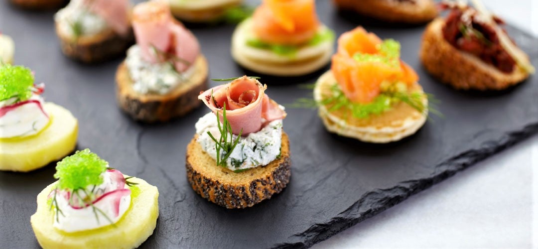 plate of entrees served on slate tray