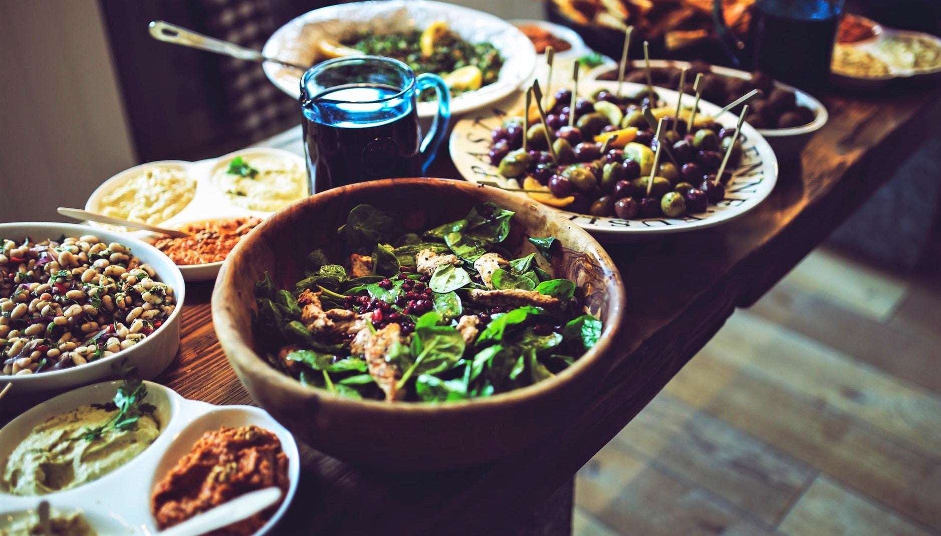 colorful array of organic produce in large clay dishes