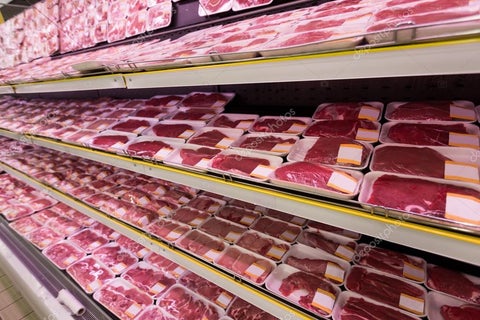 shelf full of frozen meat products in grocery store