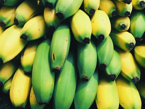 Bunch of bananas at varying stages of ripeness