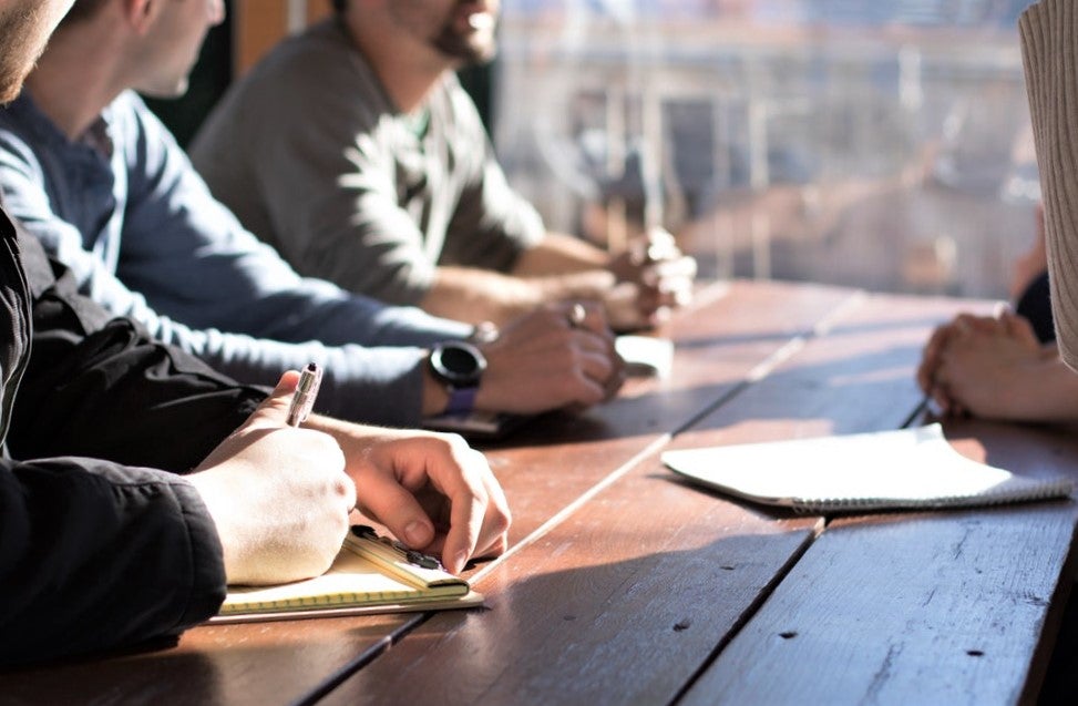 team of restaurant staff devising successful restaurant slogan